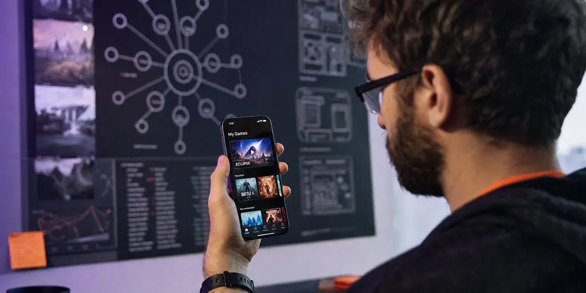 Alternative app stores landscape — gamer browsing on phone, gaming console bokeh